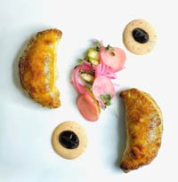 Lamb Empanadas with Harissa Yogurt, Tamarind Sauce, Pickled Vegetables