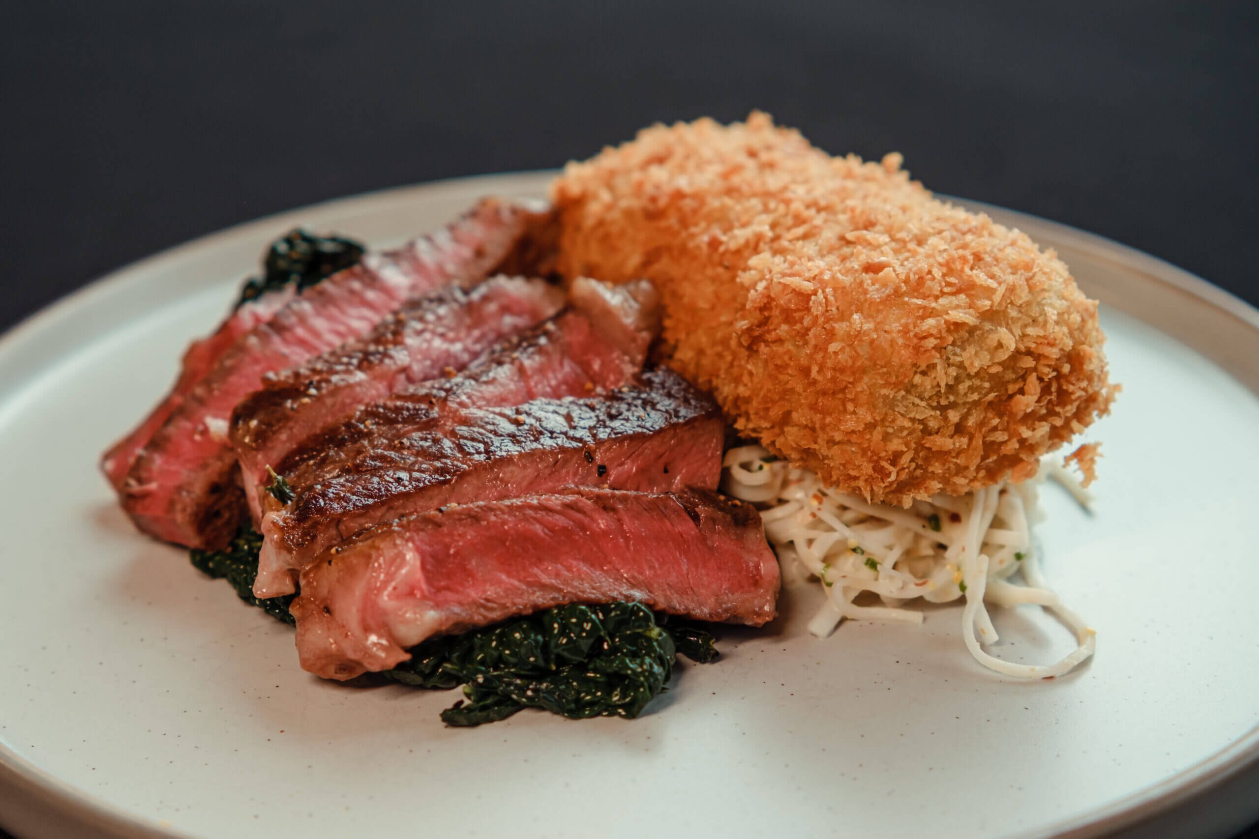 Grilled Aussie Ribeye Steak, Truffle and Stilton Croquette, Red Cabbage