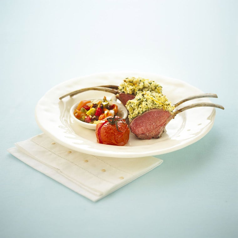 Parmesan lemon and herb crusted rack of lamb with olive muffuletta and roasted roma tomatoes