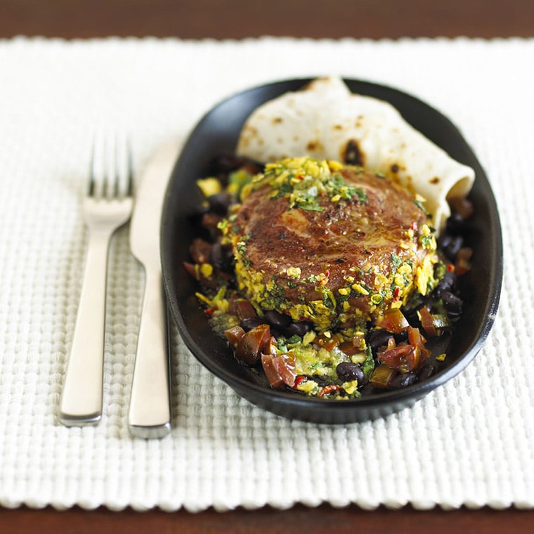 Slow-cooked ribeye with tomatillo salsa and pintos with warm tortillas