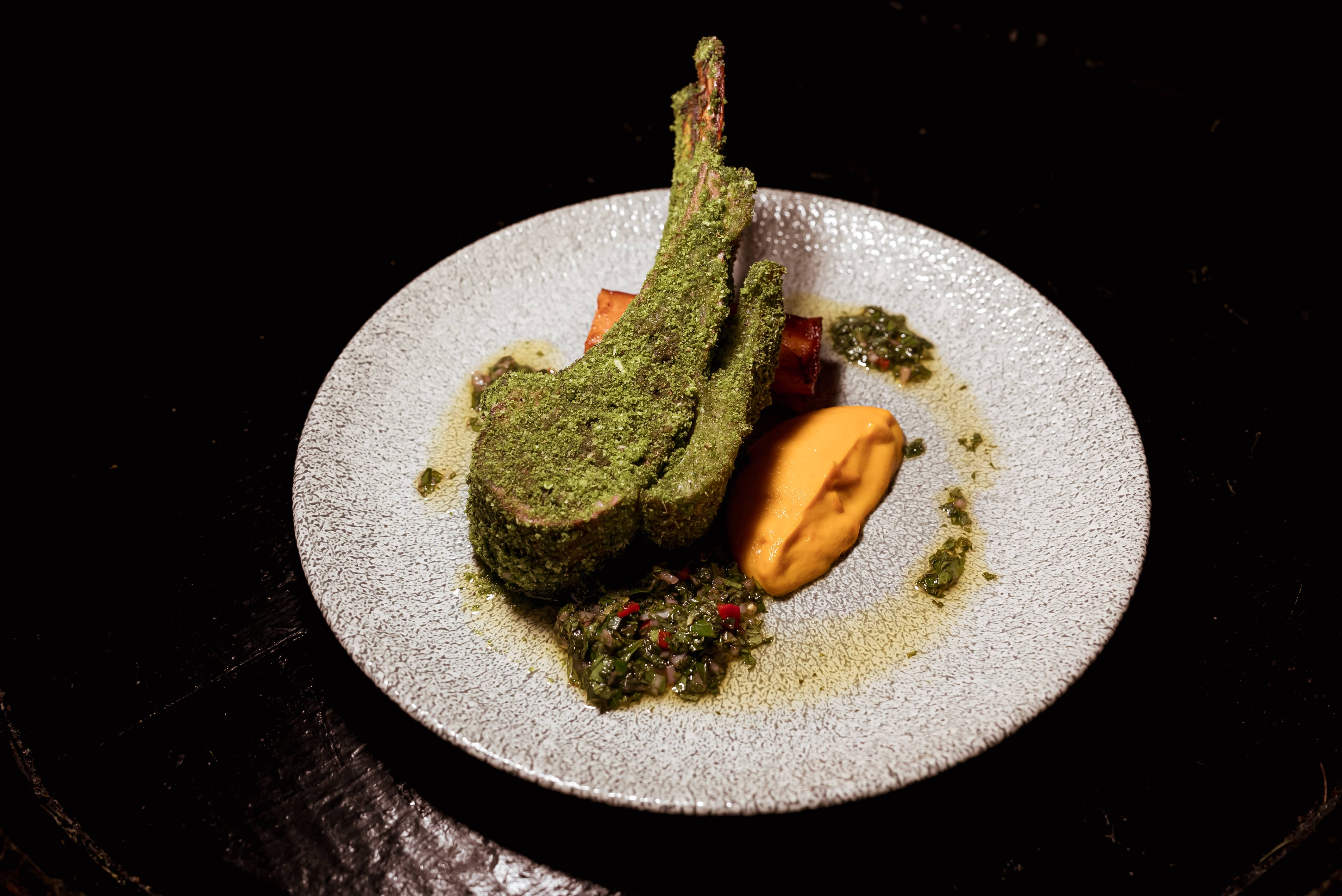 Herb Crusted Aussie Lamb, Confit Rosemary Potato Terrine, Spiced Carrot Puree, Mint Chimichurri